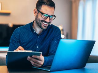 Man working at home using lap top