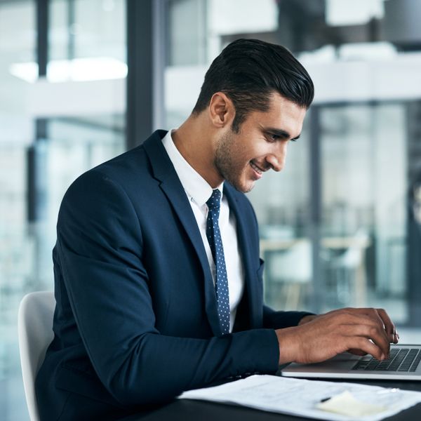 Man typing on a laptop