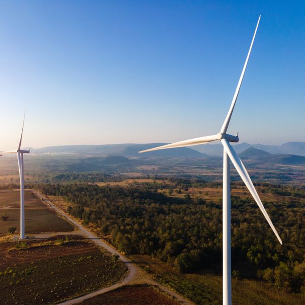 Wind energy engines with a blue sky behind