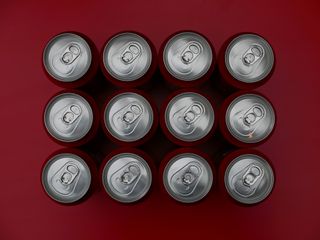 Drink cans on red background