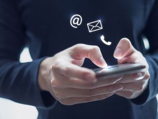 Hand of man holding mobile smartphone